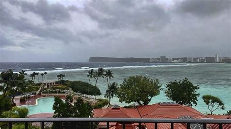 Super Typhoon Mawar passing over Guam as Category 4 storm with strong winds, rain